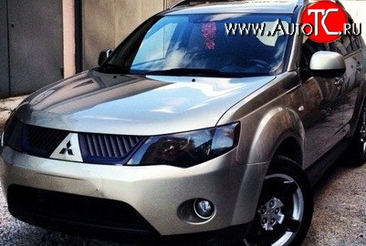 1 529 р. Темная защита передних фар SIM Mitsubishi Outlander XL (CW)  дорестайлинг (2005-2009)  с доставкой в г. Краснодар